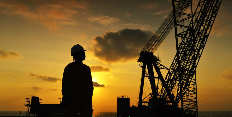 engineer ponders offshore crane